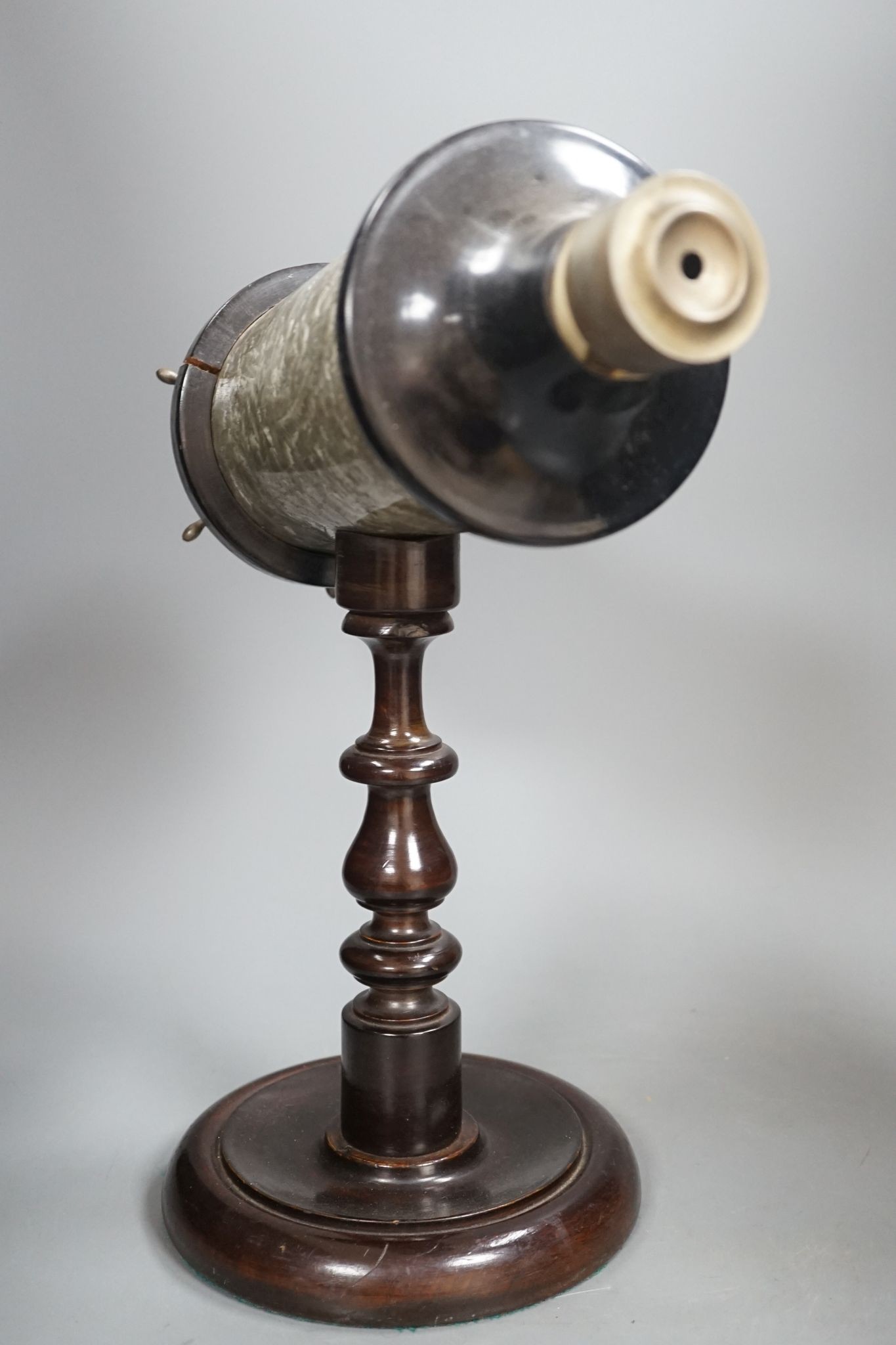 A Victorian kaleidoscope, on original turned wood stand, 39cm